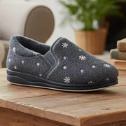 Grey low-profile slippers with white flower/star embroidery and molded rubber sole
