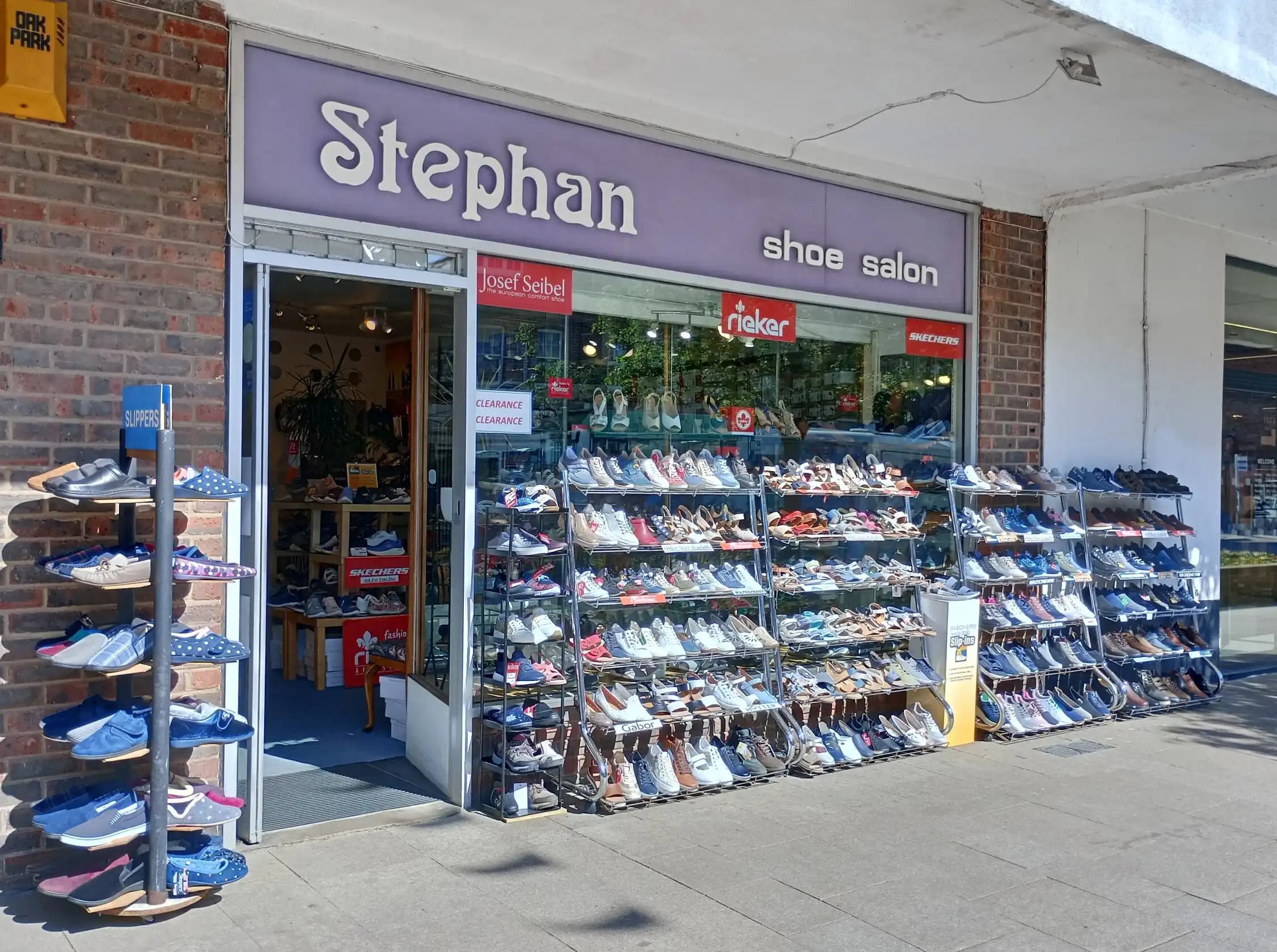 Stephan shoe shop with various shoes displayed outside on a sidewalk.
