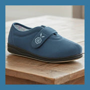 Women’s blue denim slip-on slippers with hook-and-loop strap, bird emblem