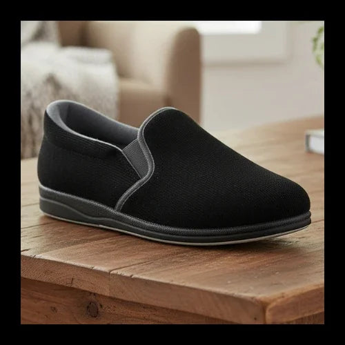 Black slip-on slippers with grey collar trim and rounded toe, flexible outsole.