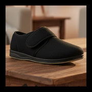 Men's black microsuede slip-on slippers with cushioned sole and rounded toe